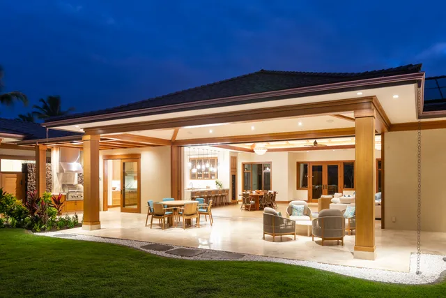 a view of a swimming pool with an outdoor seating