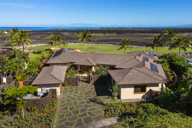 an aerial view of a house with a garden space