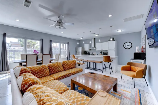 a living room with furniture and a large window