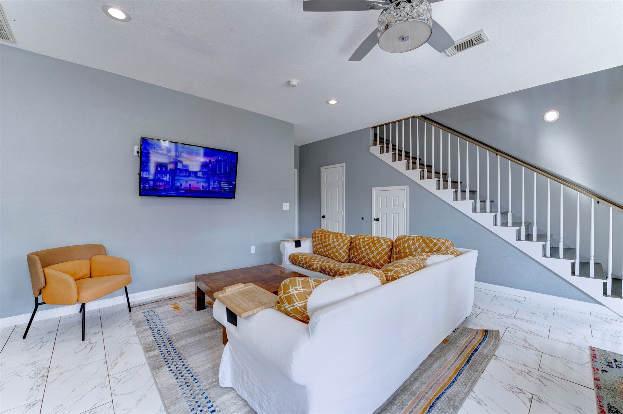 301 Tabor Street Houston, TX 77009 - Photo 13 of 33 a living room with furniture and stairs
