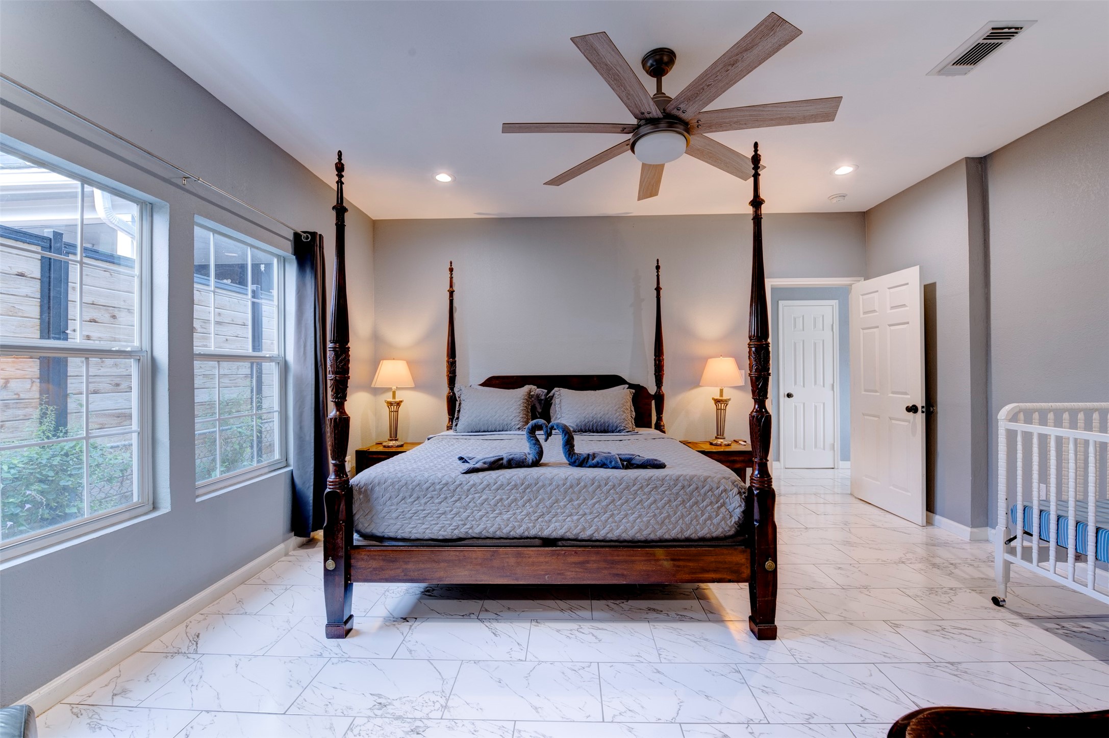 301 Tabor Street Houston, TX 77009 - Photo 15 of 33 a bedroom with a bed and a table