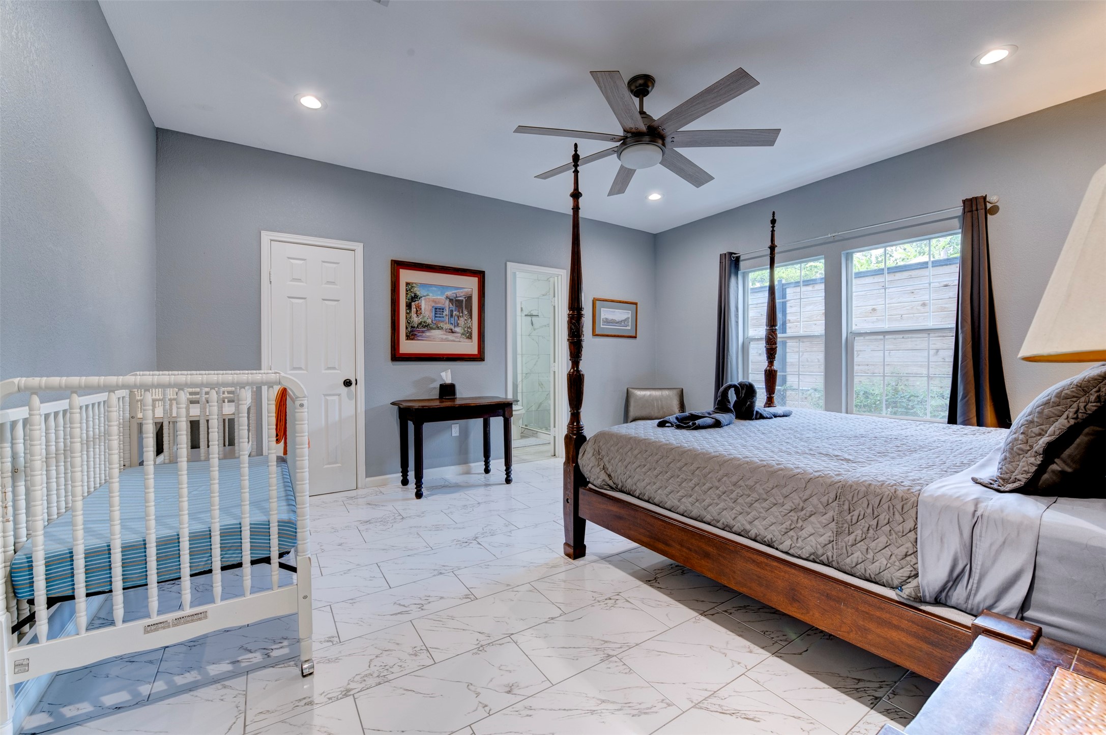 301 Tabor Street Houston, TX 77009 - Photo 16 of 33 a bed room with a bed and a window