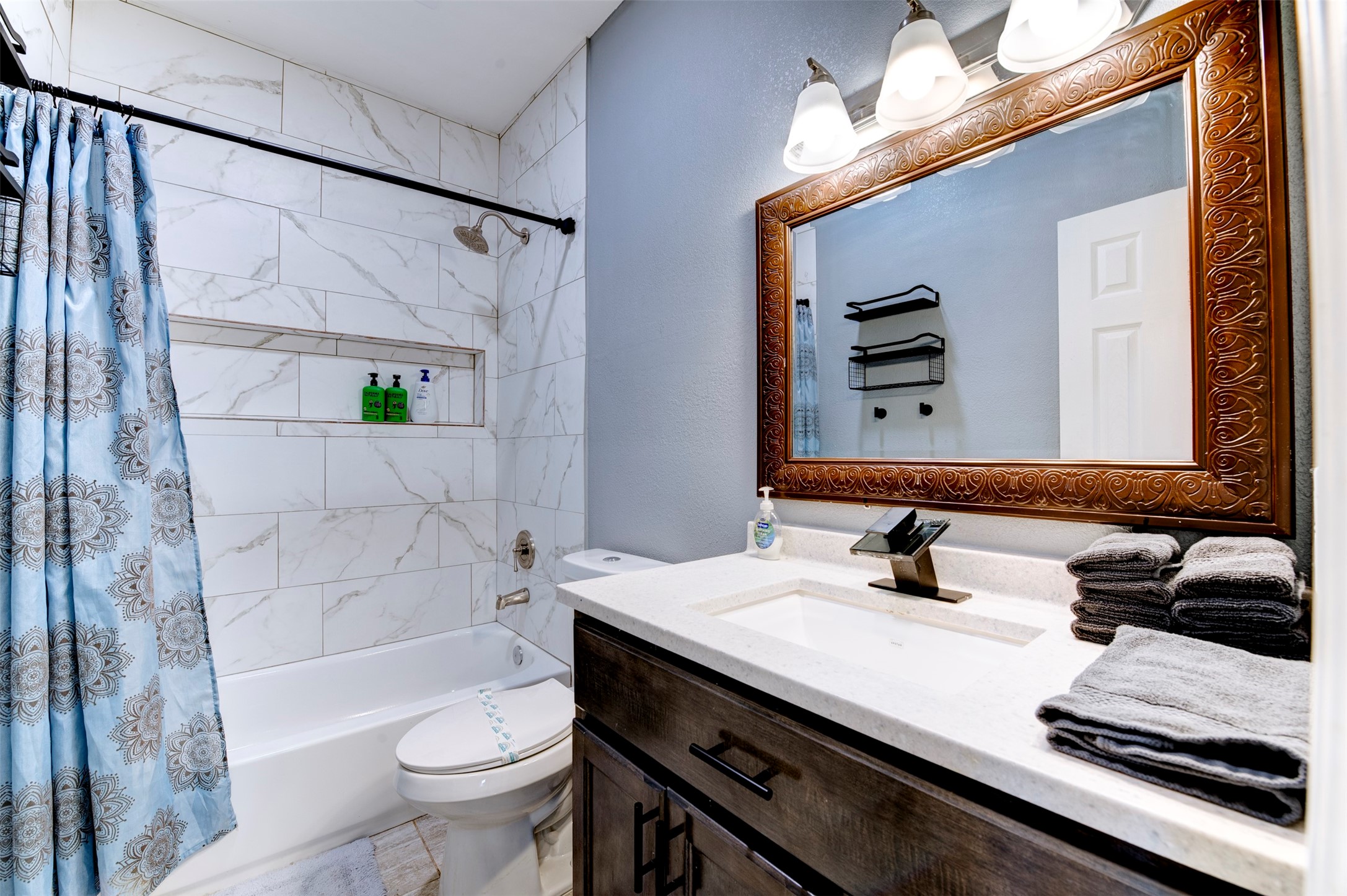 301 Tabor Street Houston, TX 77009 - Photo 24 of 33 a bathroom with a sink a toilet and a mirror