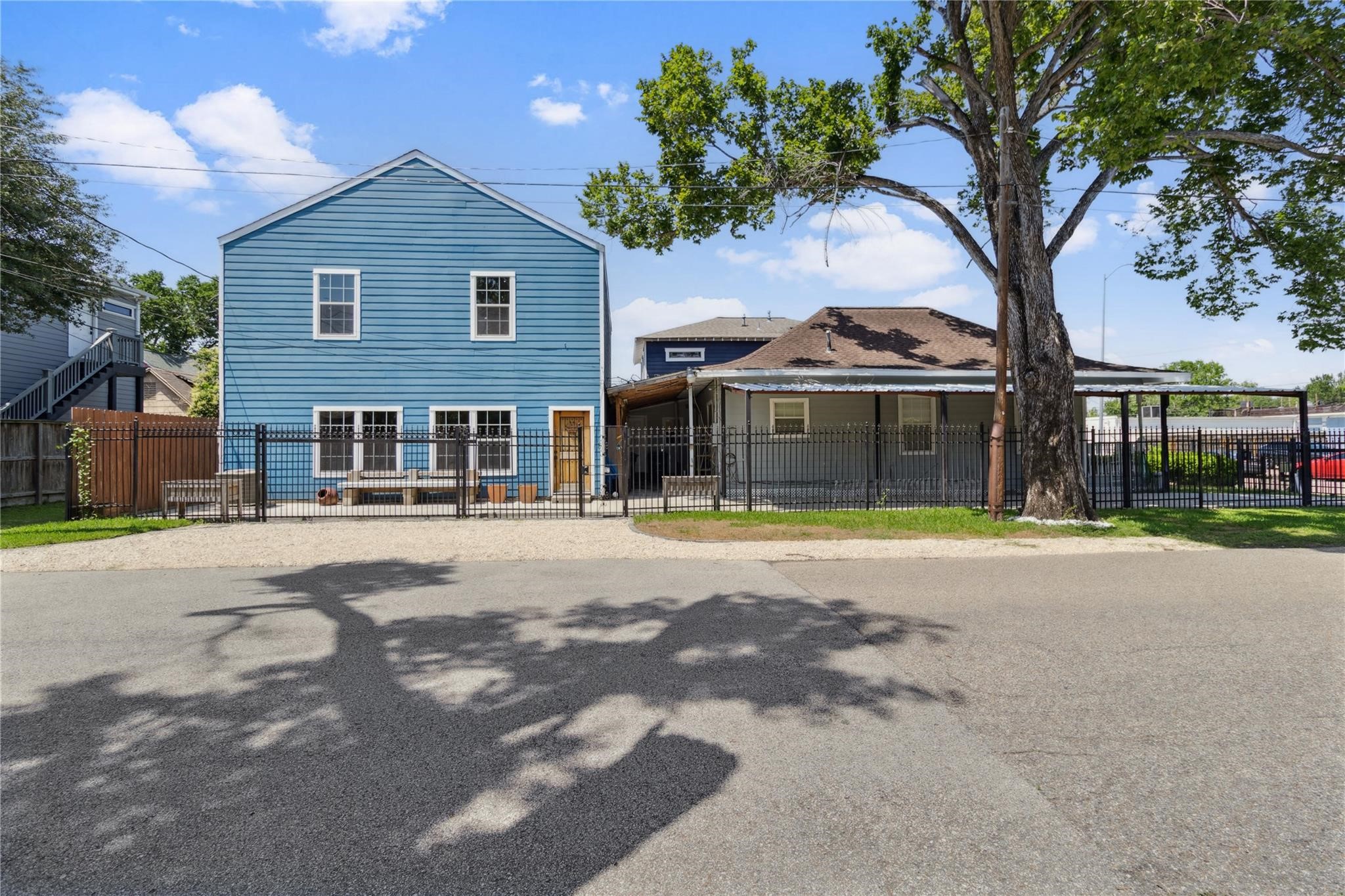301 Tabor Street Houston, TX 77009 - Photo 3 of 33 a front view of a house with a garden and trees