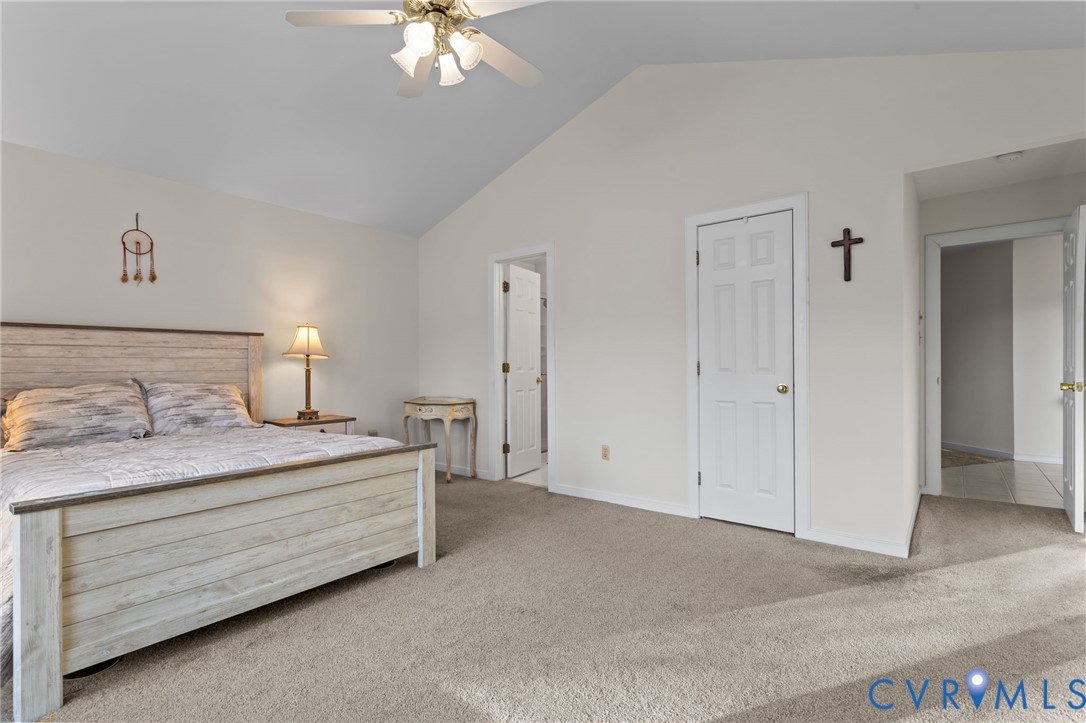 518 Rebel Ridge Road Colonial Heights, VA 23834 - Photo 31 of 44 a bedroom with a bed and a chandelier