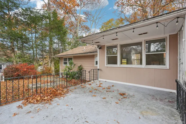 a front view of a house with a outdoor space