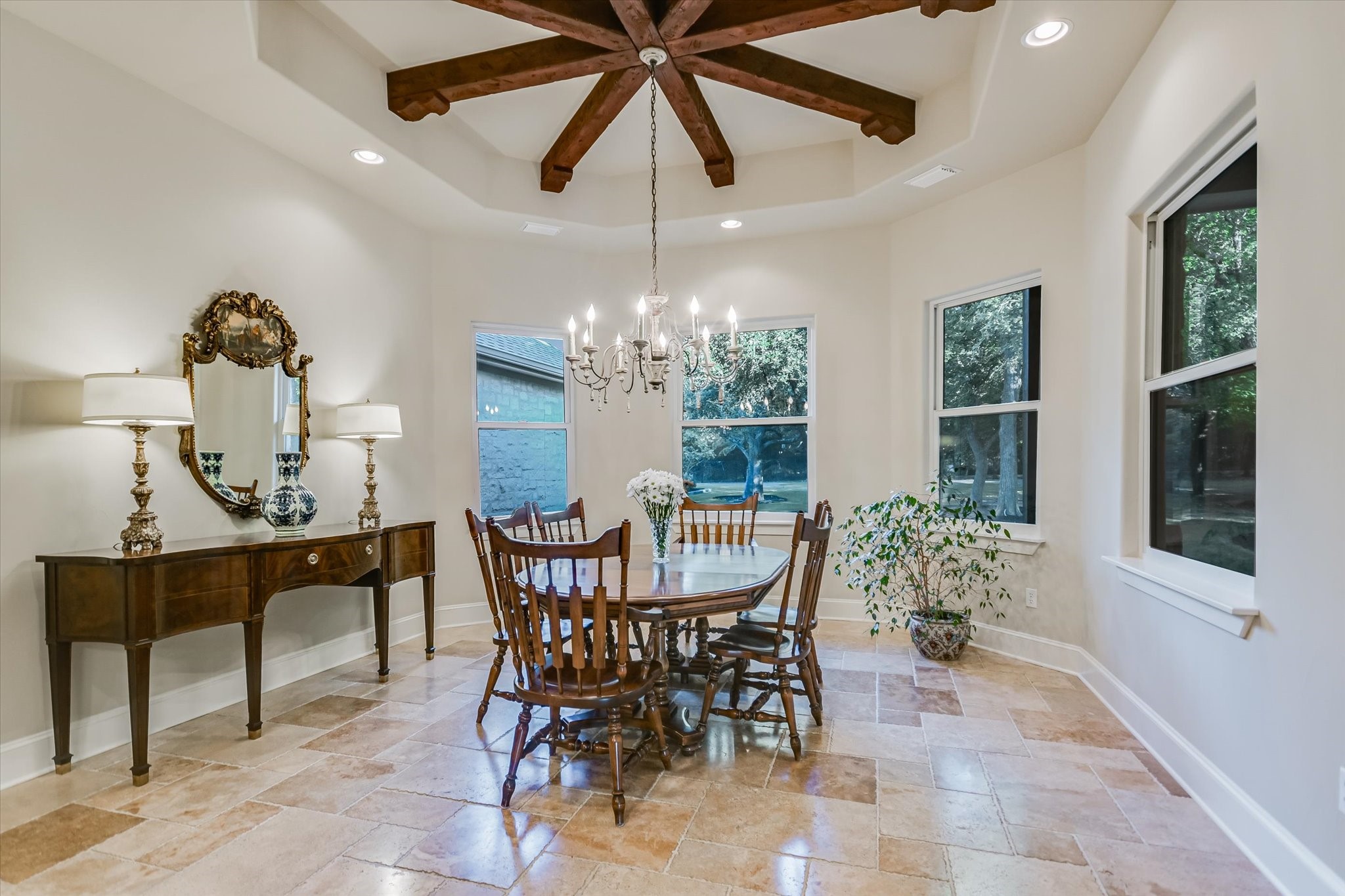 112 Gabriel Vista East Georgetown, TX 78633 - Photo 13 of 34 a dining room with furniture a potted plant and a chandelier