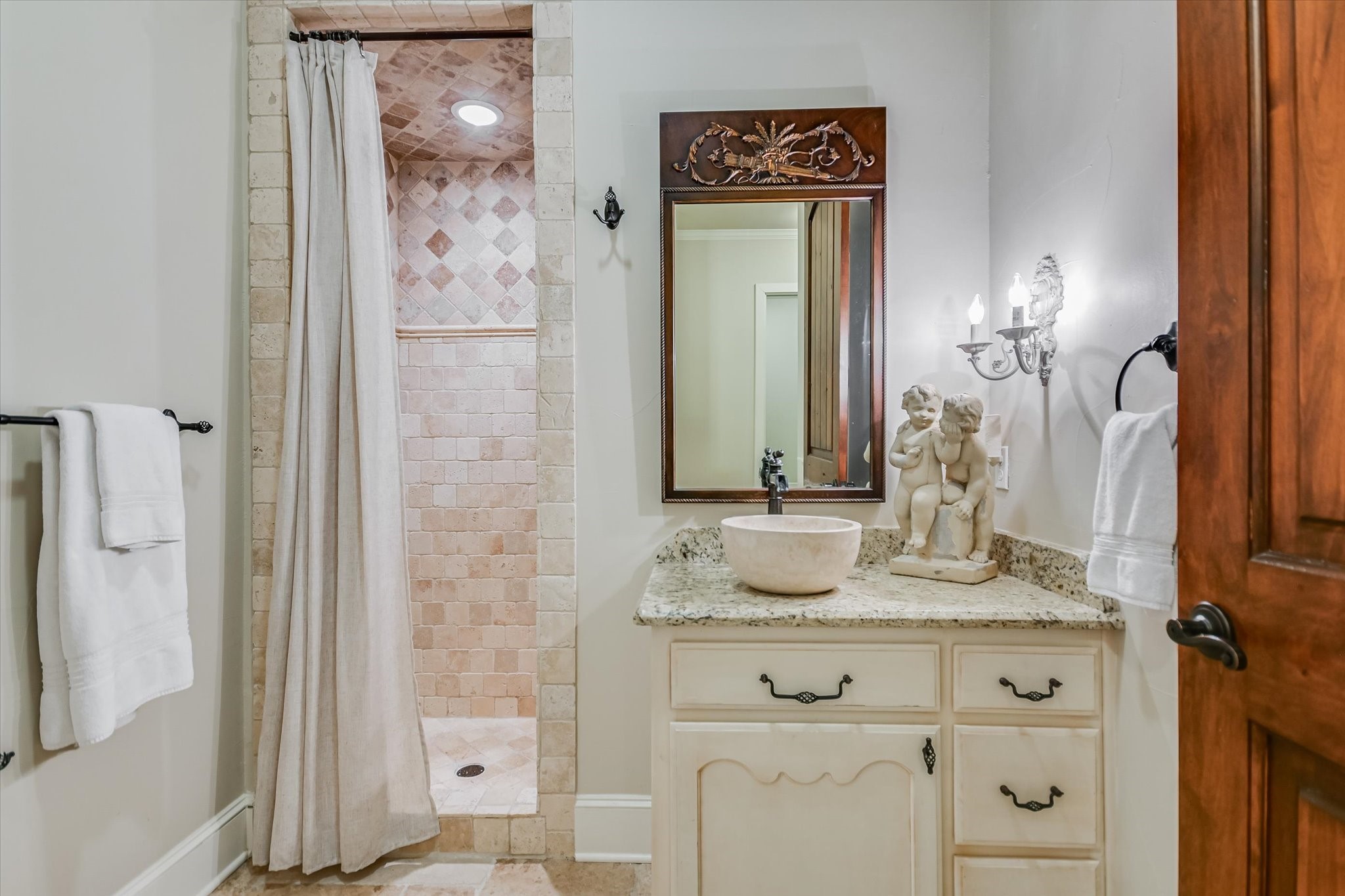 112 Gabriel Vista East Georgetown, TX 78633 - Photo 21 of 34 a bathroom with a granite countertop shower sink and mirror