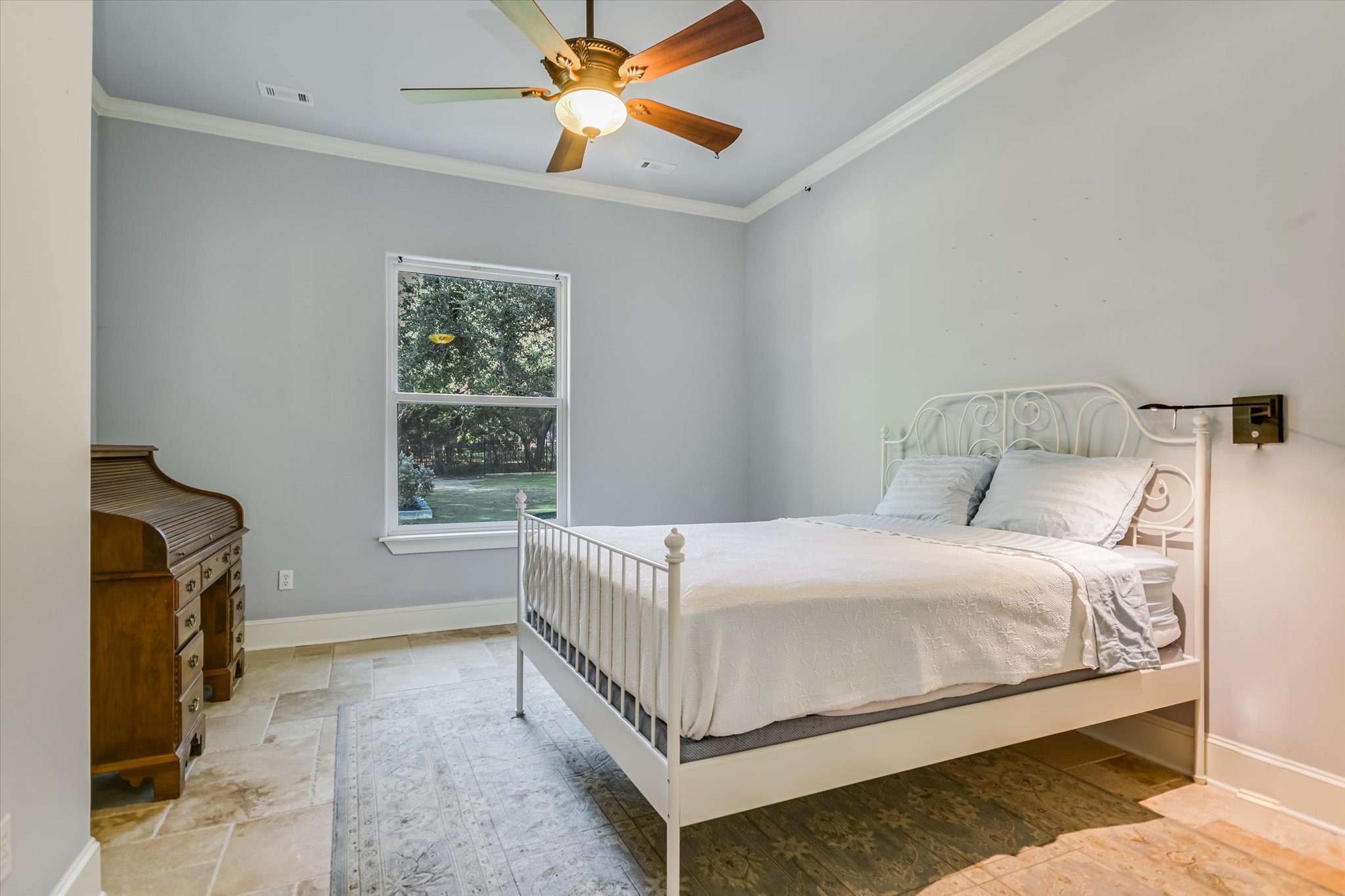112 Gabriel Vista East Georgetown, TX 78633 - Photo 30 of 34 a bedroom with a bed lamp and a window