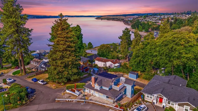 an aerial view of a house with a lake view