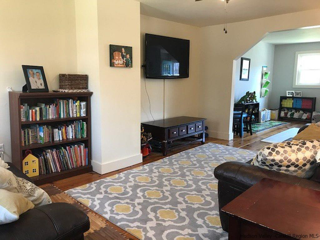 183 Beecher Hill Road Wallkill, NY 12589 - Photo 10 of 33 a living room with furniture and a flat screen tv