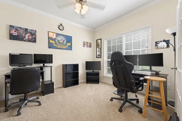 a view of a workspace with furniture
