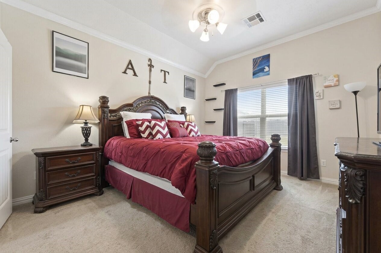 8106 Rudy Brook Way Spring, TX 77379 - Photo 12 of 20 a bedroom with a bed and window