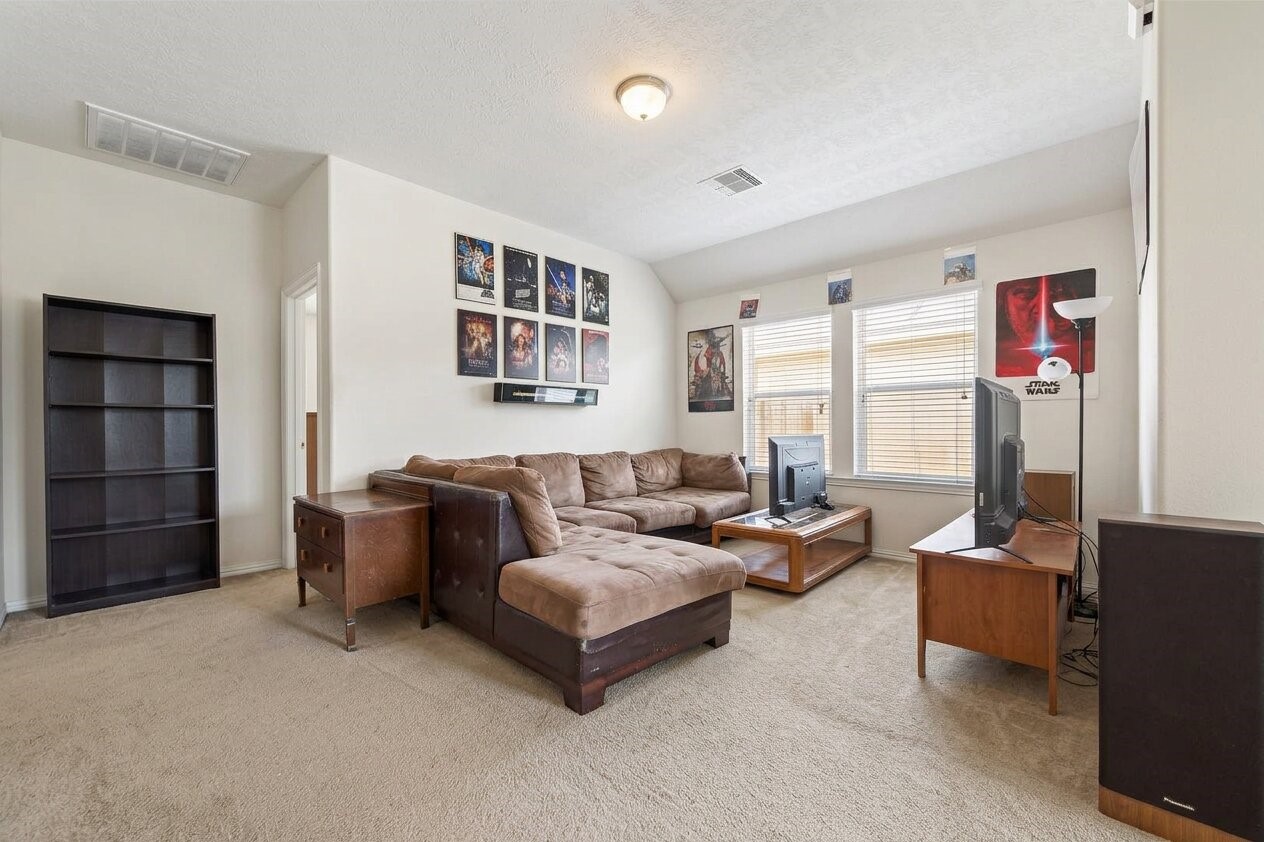 8106 Rudy Brook Way Spring, TX 77379 - Photo 14 of 20 a living room with furniture and a window