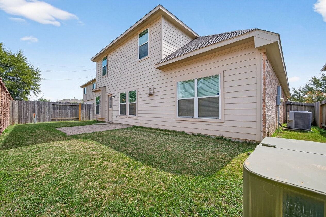 8106 Rudy Brook Way Spring, TX 77379 - Photo 19 of 20 a backyard of a house with a garden and barbeque oven