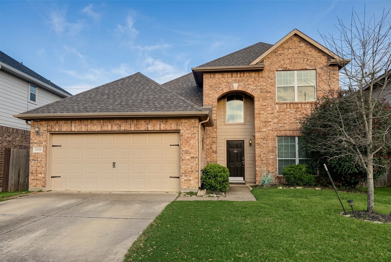 8106 Rudy Brook Way Spring, TX 77379 - Photo 2 of 20 a front view of a house with garden