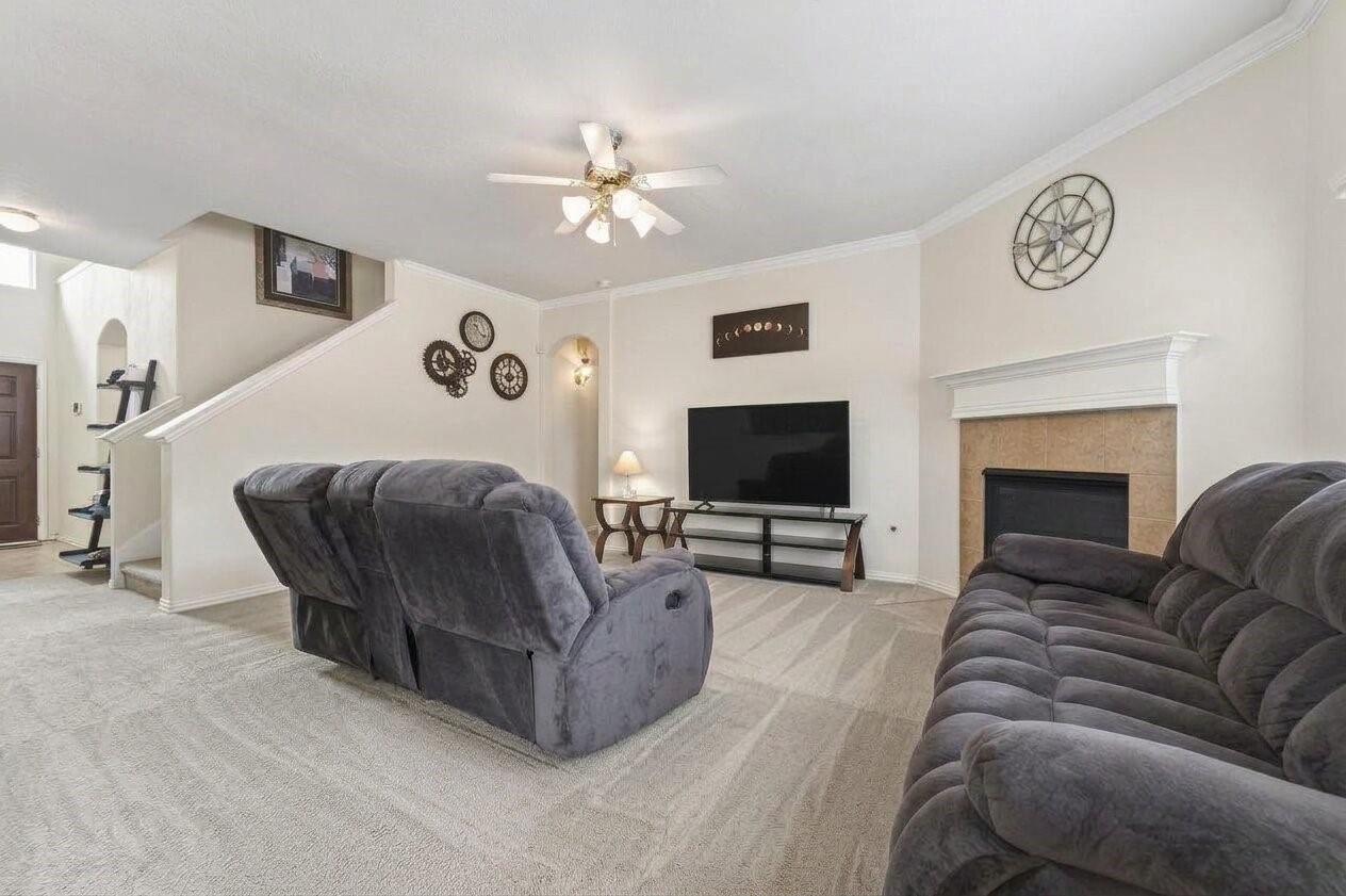 8106 Rudy Brook Way Spring, TX 77379 - Photo 4 of 20 a living room with furniture and a flat screen tv