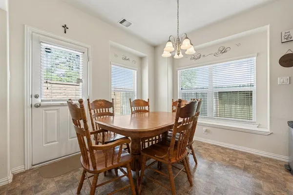 a view of a dining room with furniture window and outside view