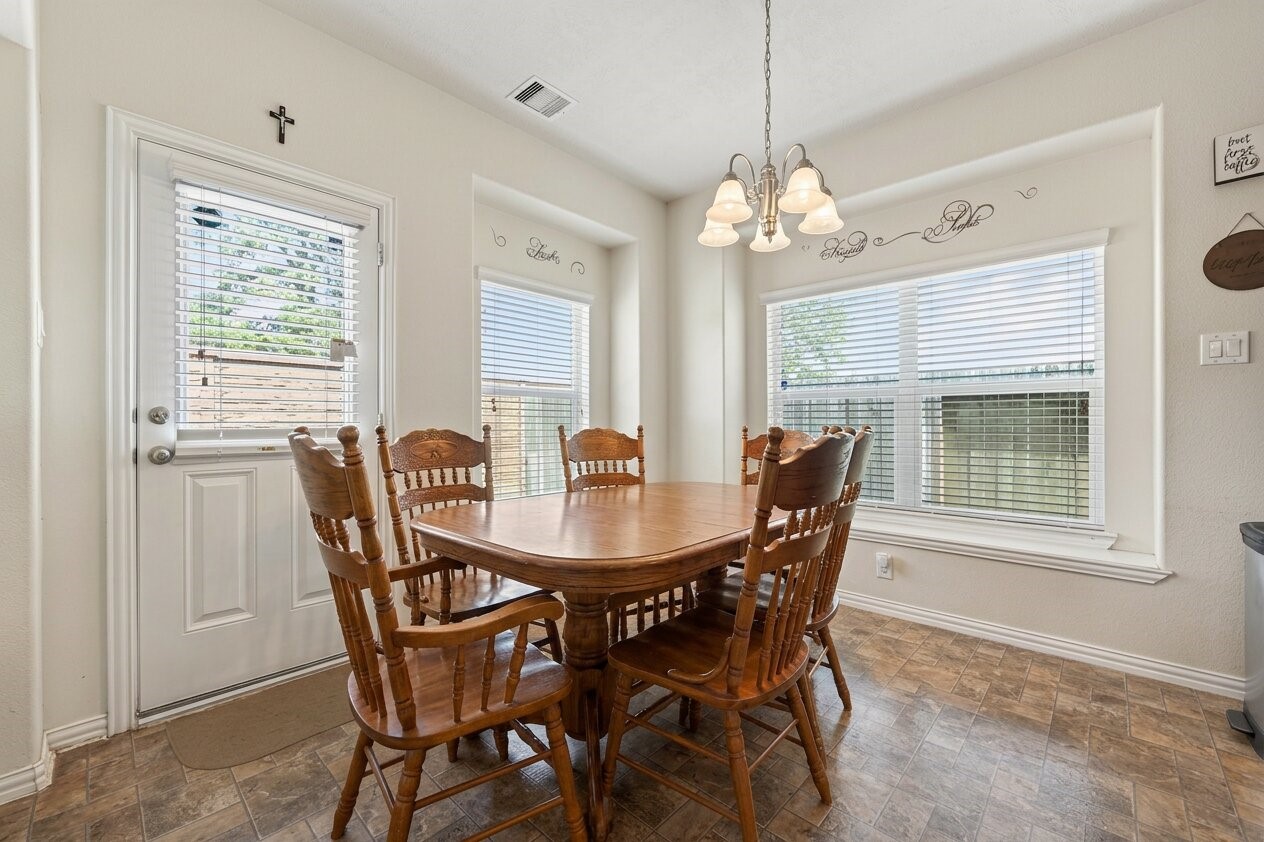8106 Rudy Brook Way Spring, TX 77379 - Photo 10 of 20 a view of a dining room with furniture window and outside view