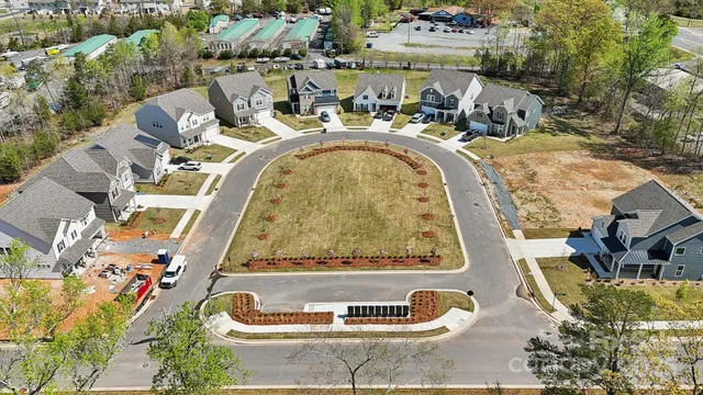 an aerial view of a house with a swimming pool
