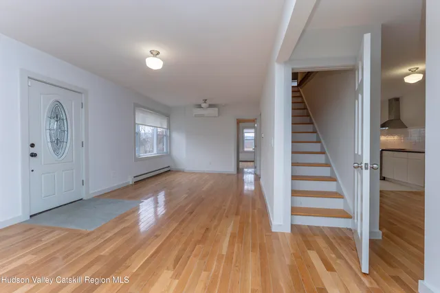 a view of entryway with wooden floor