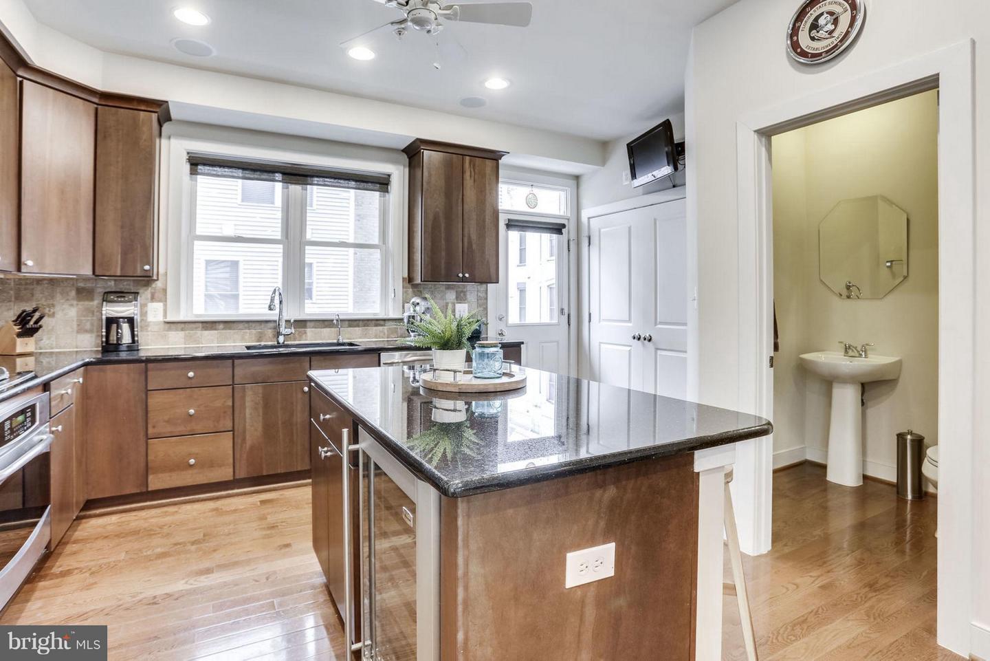 419 K Street Southeast Washington, DC 20003 - Photo 8 of 27 CENTER ISLAND COUNTER TOP WITH BAR STOOL AREA