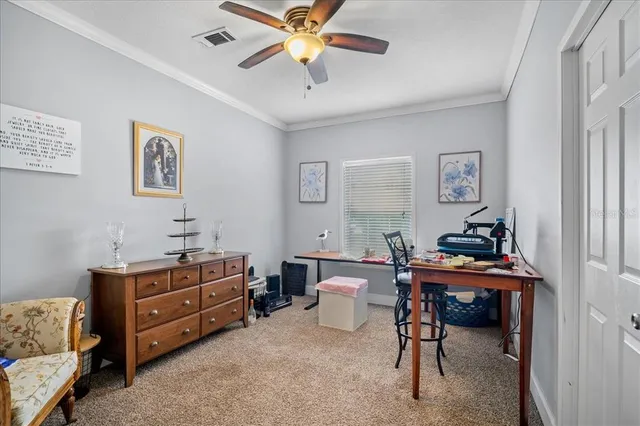a room with furniture and a fan