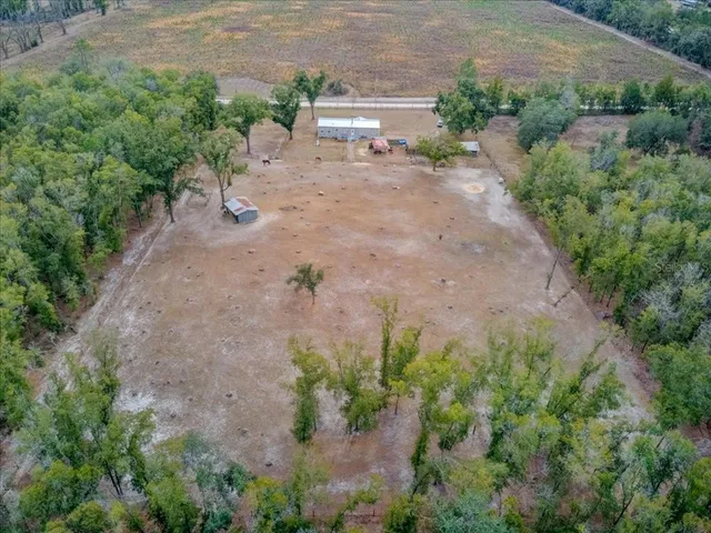 an aerial view of a house with swimming pool