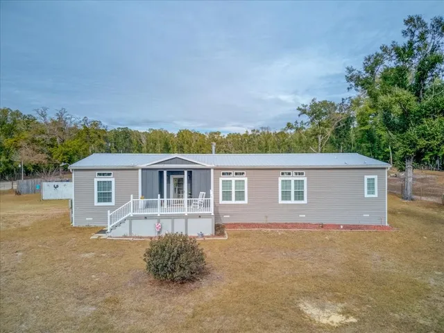 front view of a house with a patio