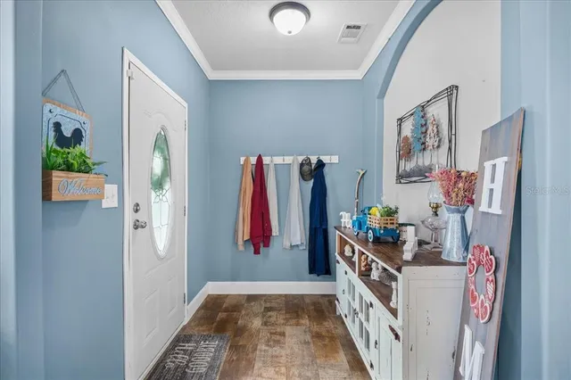 a view of a hallway with workspace and entryway