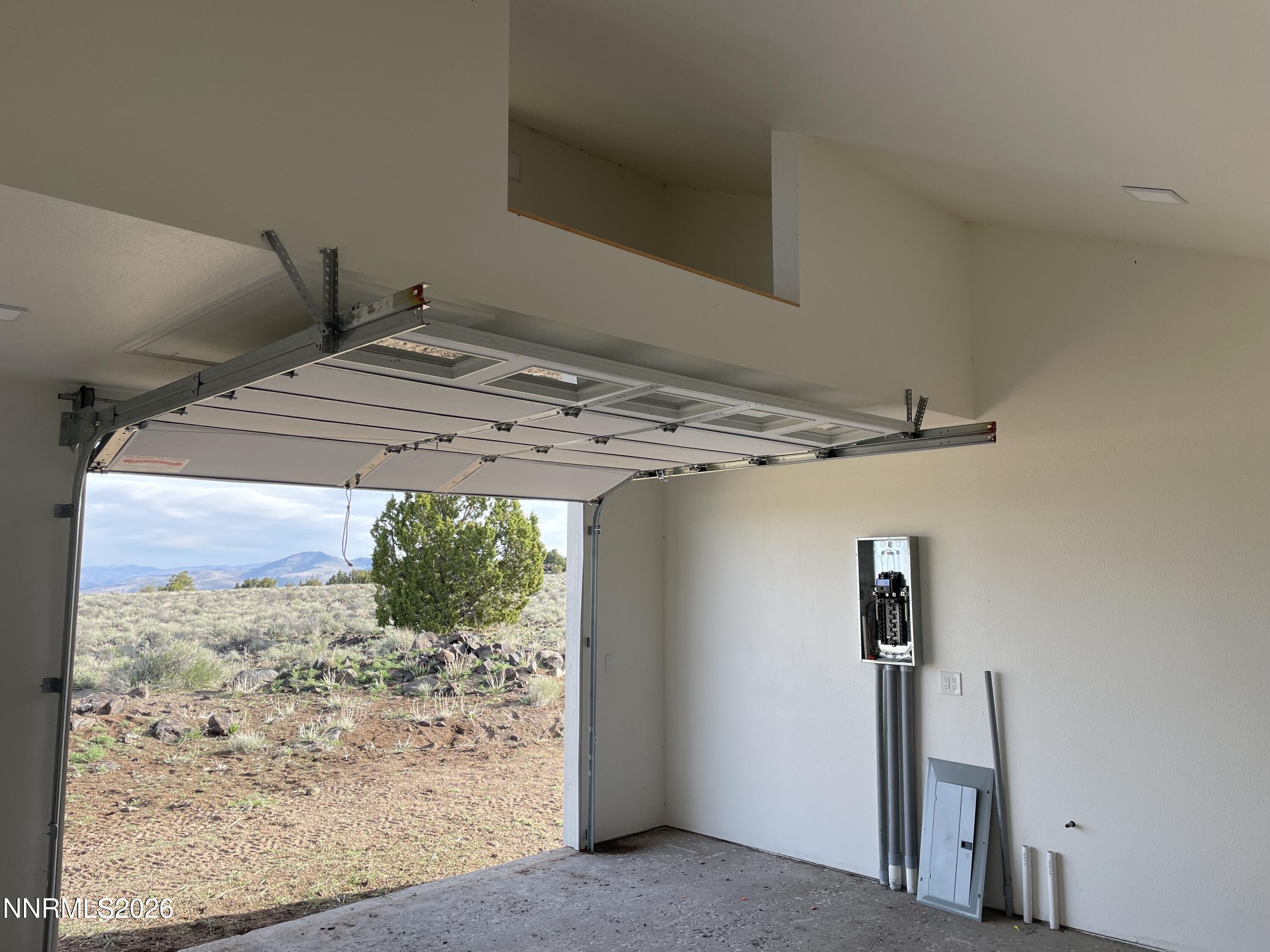 6600 Goldfield Road Reno, NV 89521 - Photo 5 of 23 a view of a room with a bed and wooden floor
