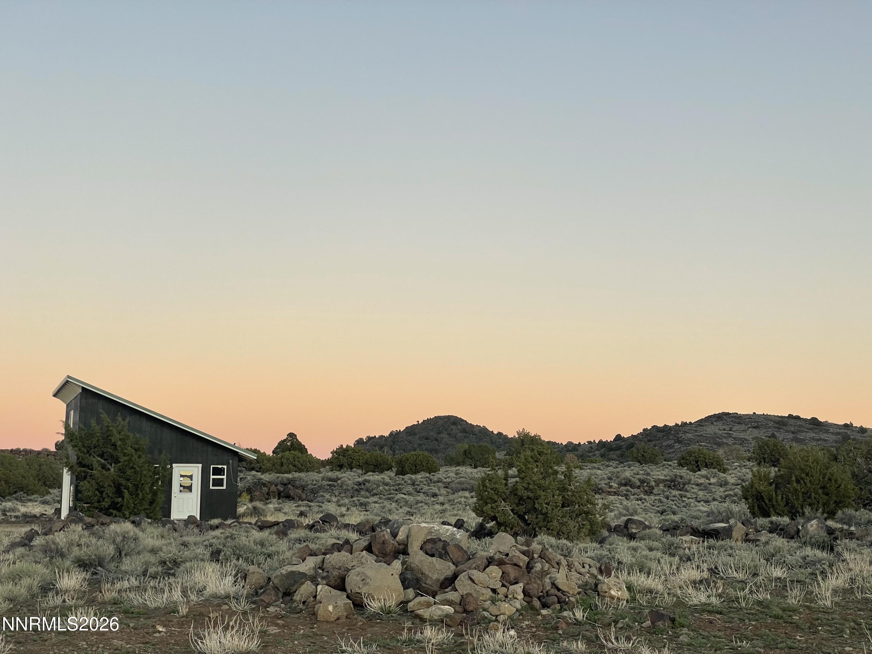 6600 Goldfield Road Reno, NV 89521 - Photo 8 of 23 a view of a mountain in the distance in a field