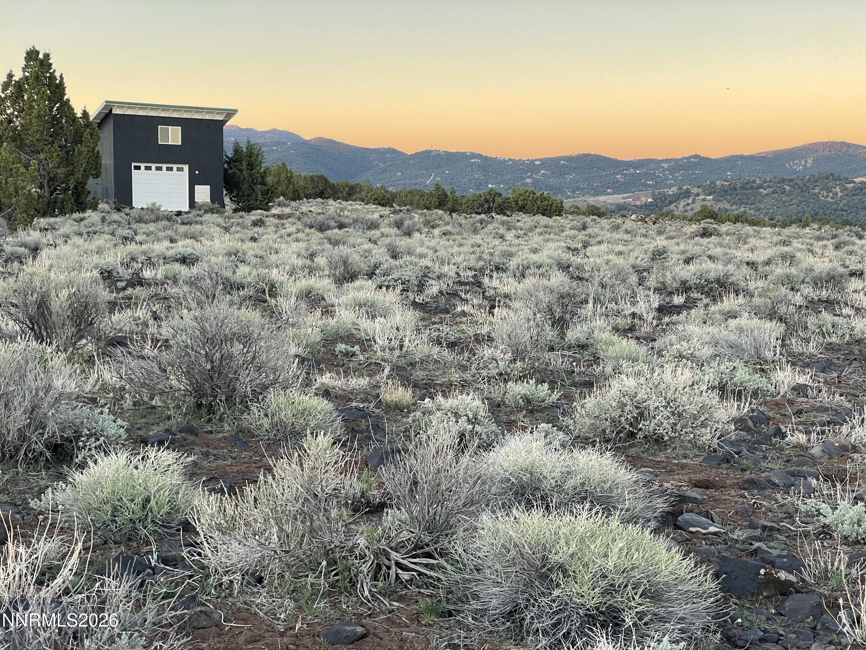 6600 Goldfield Road Reno, NV 89521 - Photo 9 of 23 a view of a wooden house with a yard