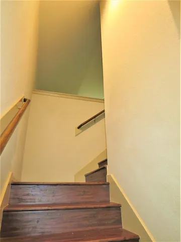 a view of balcony with wooden floor