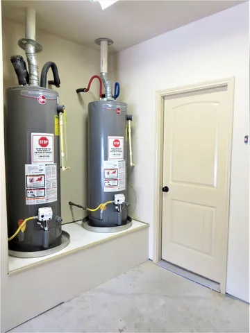 a room with a mirror and cabinets