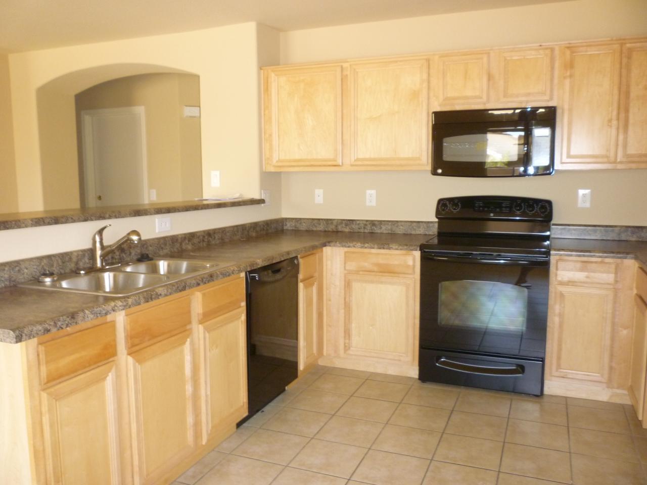 9135 West Cordes Road Tolleson, AZ 85353 - Photo 3 of 5 Kitchen with new black appliances