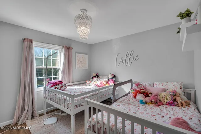 a bedroom with furniture and a window