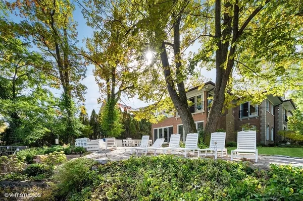 a house view with a sitting space and garden view