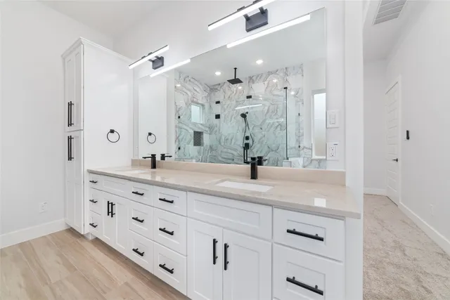 a view of a house with a big yard and a large tree