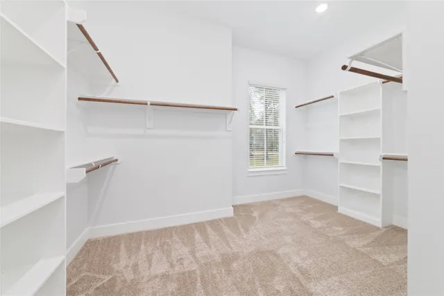 a view of a porch with a table and chairs