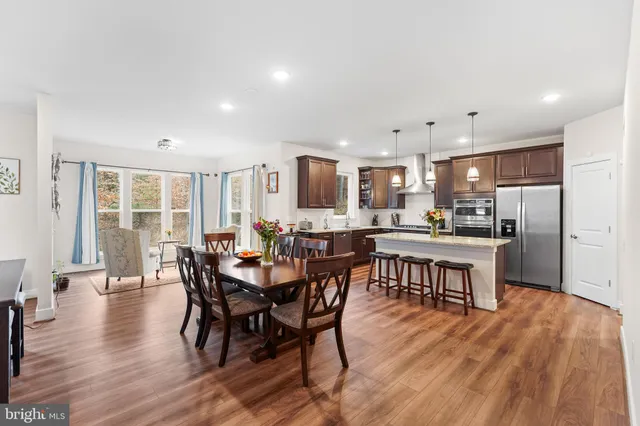 a view of a dining area with furniture and wooden floor