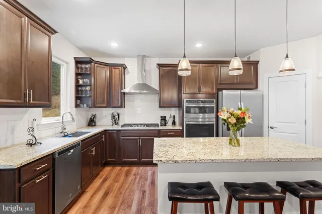 a bedroom with a bed lamp and a large window