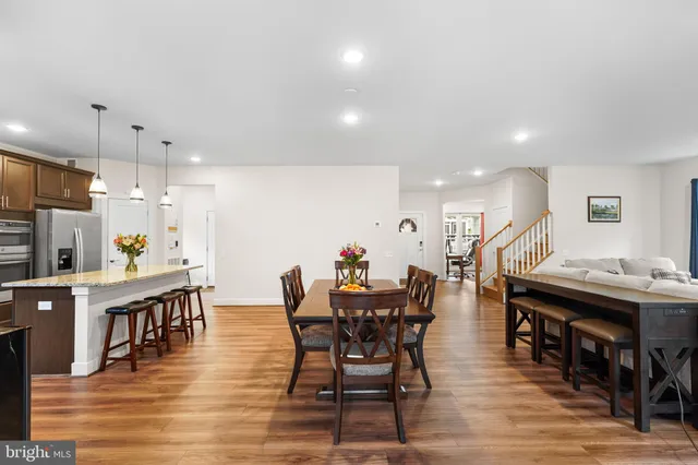 a view of bathroom with a toilet sink and mirror