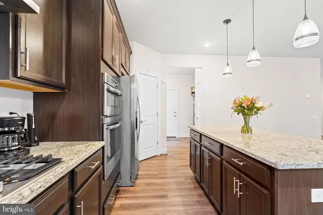 a bathroom with a sink vanity and a mirror