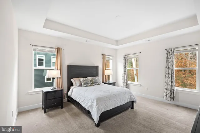 a bedroom with a bed and a television