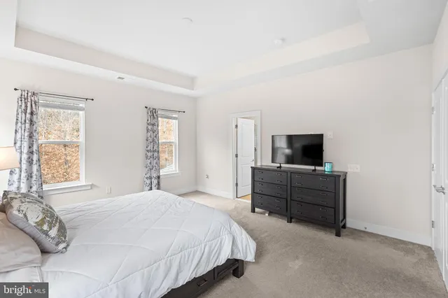 a bedroom with a bed and a table