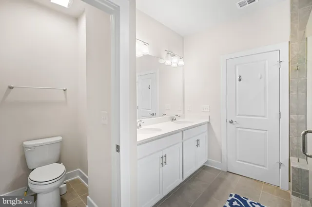 a bedroom with a bed and a television