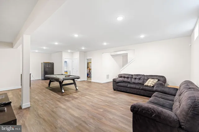 a view of a chairs and table in the backyard