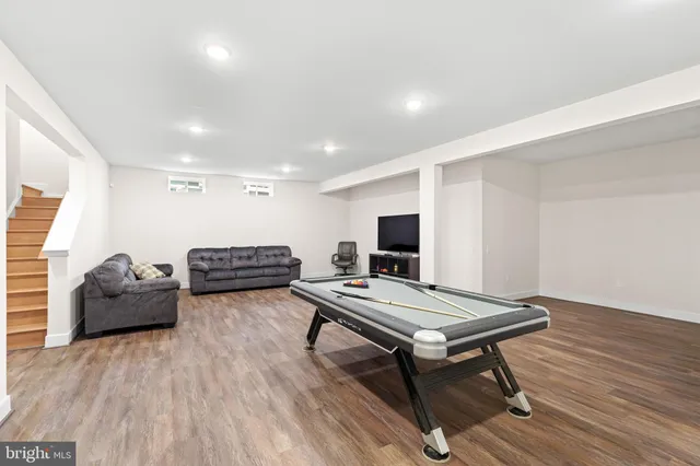 an aerial view of a house with a swimming pool yard and outdoor seating