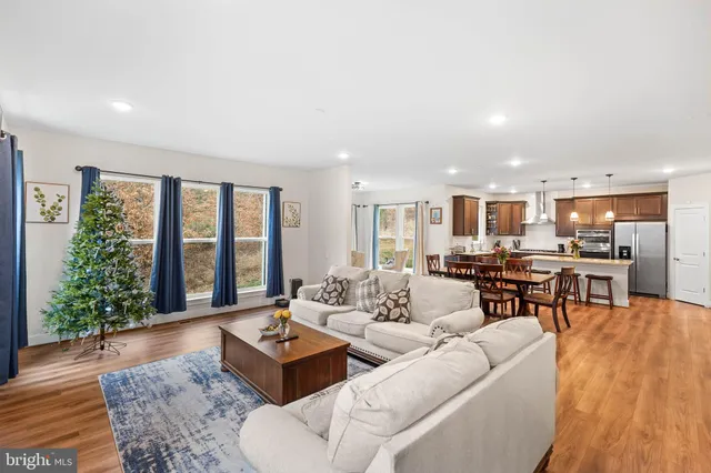 a kitchen with stainless steel appliances kitchen island granite countertop a sink and cabinets